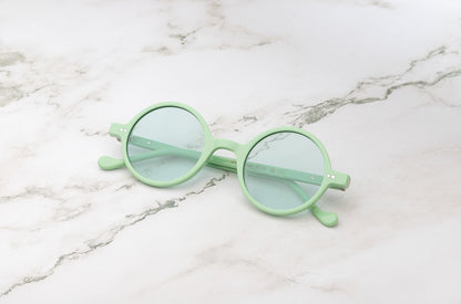 The Kopajos Petra sunglasses with light green frame and lenses