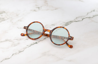 Kopajos Petra, a pair of chic, tortoise round sunglasses.